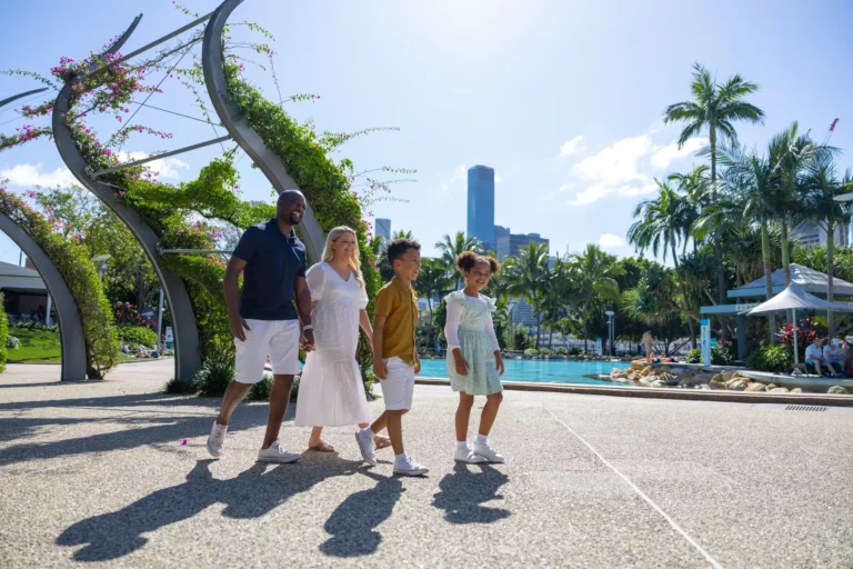 Family walking past the pool in South Bank